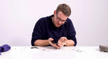 The iPhone gets scratched with pebbles from outside.