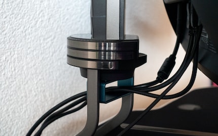 The hard plastic and metal stand also provides a cable management solution