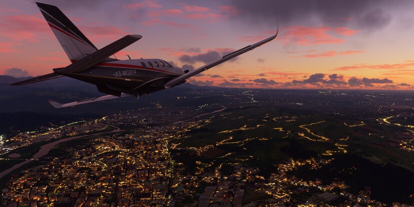 Aussicht aus einer AS-MGS14 über eine Stadt bei Dämmerung.