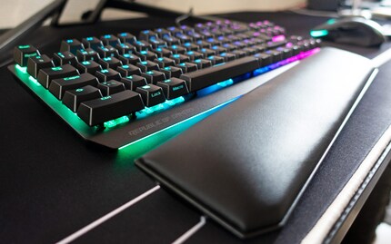 A palm rest covers the RGB LED Light Bar.