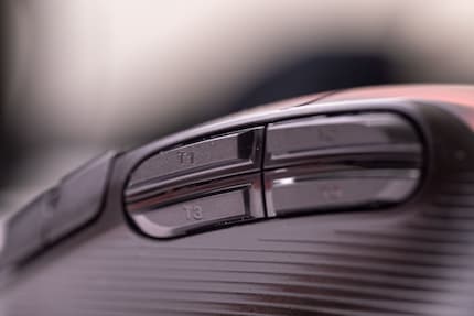 The upper side buttons feel spongy and are hard to reach.