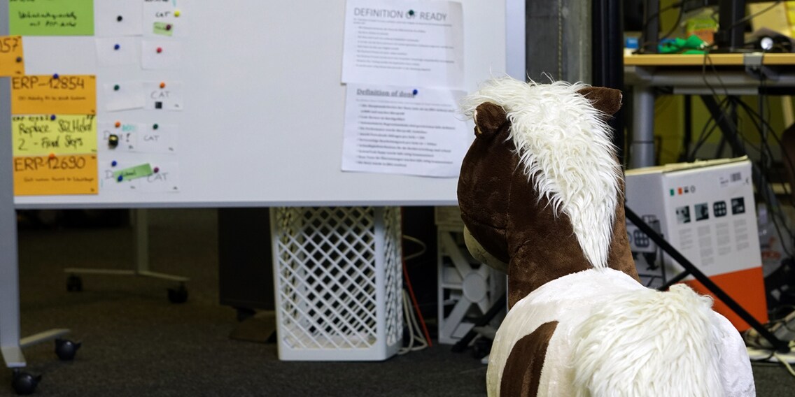Our mascot Poonita taking a close look at our current sprint.
