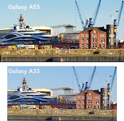 Luxury yacht and an old shipyard building