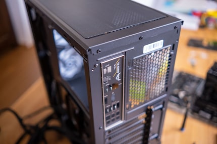 You should mount the I/O panel in the back in front of the main board.