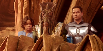 A young Boba Fett (left) and his father, Jango Fett (right).