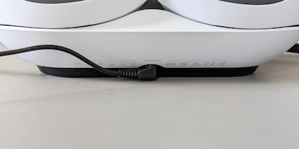 The charging station is powered by a separate power supply unit.