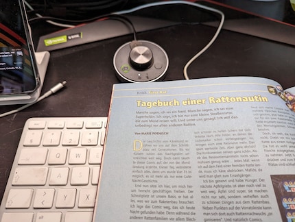 Je peux lire des documents imprimés comme cette critique de jeu de société.