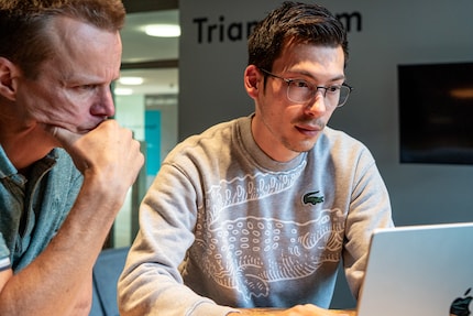 Martin Wrona (right) showing me some scammers’ tricks on his screen.