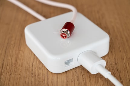 Elegant: the LAN port is integrated into the power supply. The power cable connector is an Apple development, clicking into the port magnetically.