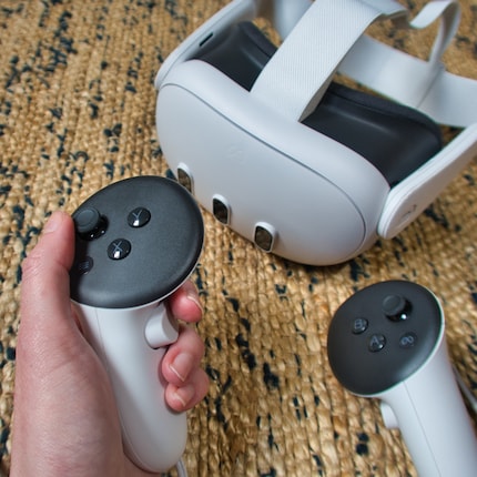 The headset has become a little slimmer and the controllers no longer have tracking rings.