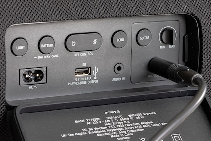 Numerous buttons and connections are hidden under the rubber cover.