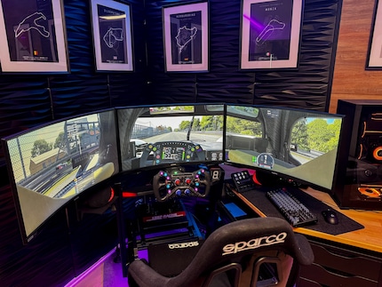 Three monitors next to each other offer a more immersive racing experience.