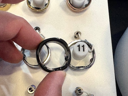 The first ring in black compared with the thinner, new rings.