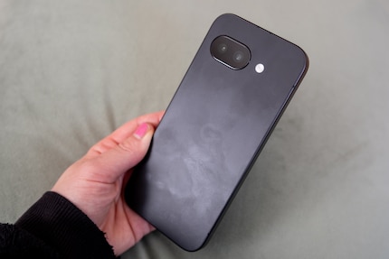 The plastic back shows fingerprints.