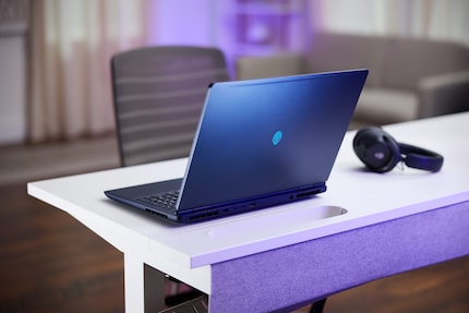 The Alienware logo identifies the Aurora 16 as a gaming laptop.