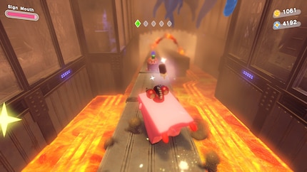 Als Kirby-Schlitten fahre ich in den Vulkan hinab.